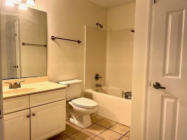 full bath with  shower combination, vanity, toilet, and tile patterned floors