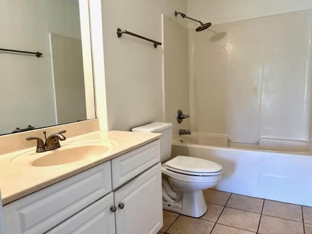 bathroom with toilet, bathtub / shower combination, vanity, and tile patterned floors