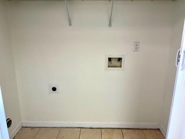 laundry room featuring light tile patterned floors, washer hookup, electric dryer hookup, and baseboards