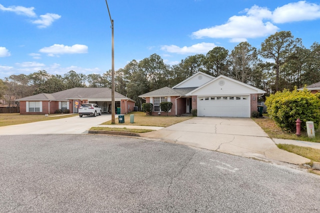 single story home with a front lawn, brick siding, driveway, and an attached garage