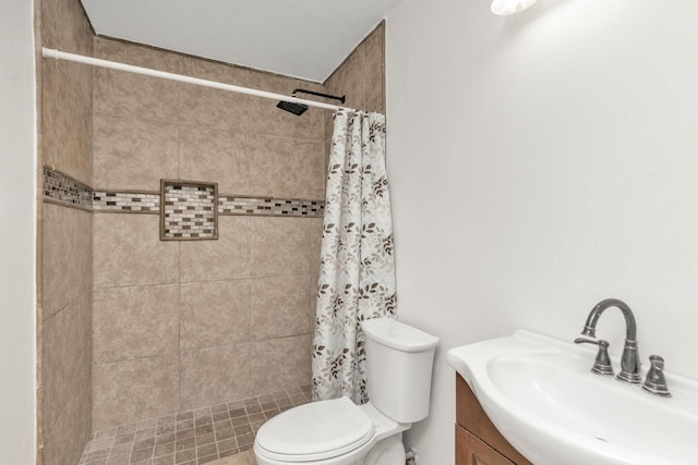 full bath featuring a shower stall, vanity, and toilet