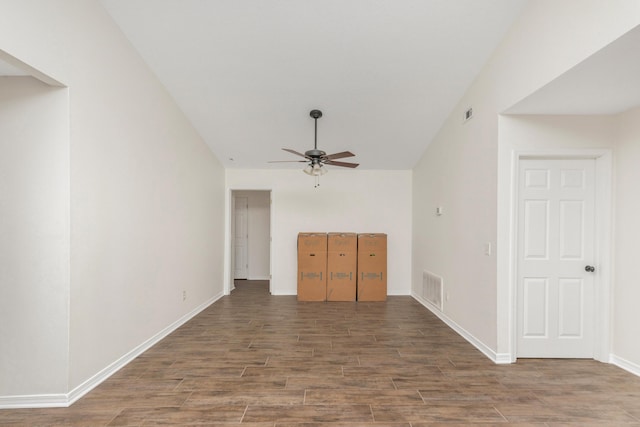 unfurnished living room featuring baseboards, ceiling fan, visible vents, and wood finished floors