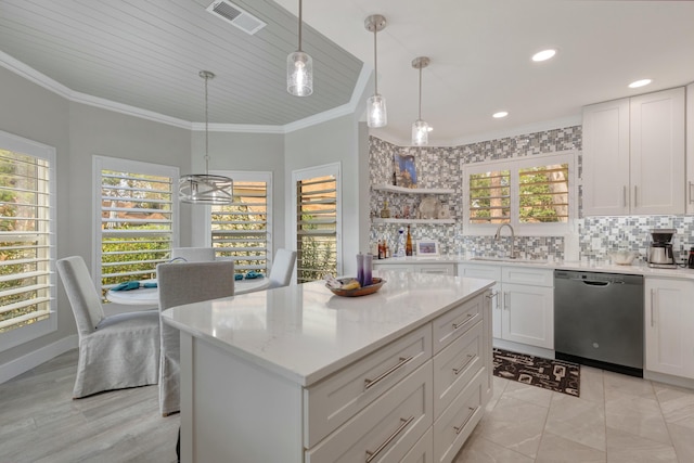 kitchen featuring a center island, white cabinets, black dishwasher, decorative backsplash, and pendant lighting