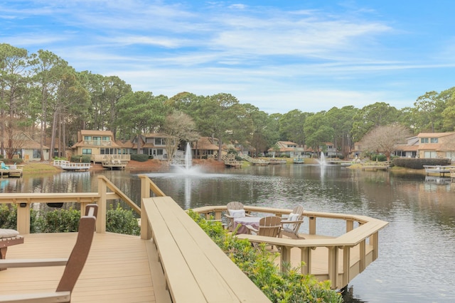 dock area with a water view and a residential view