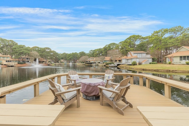 dock area with a water view and a residential view