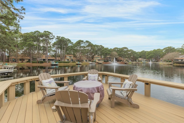 view of dock featuring a residential view and a water view