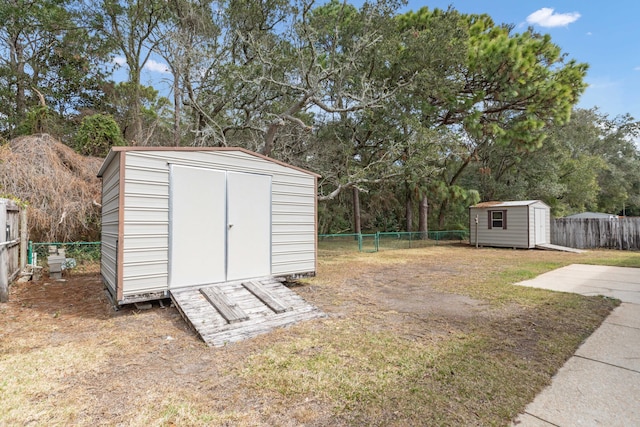 view of shed with a fenced backyard