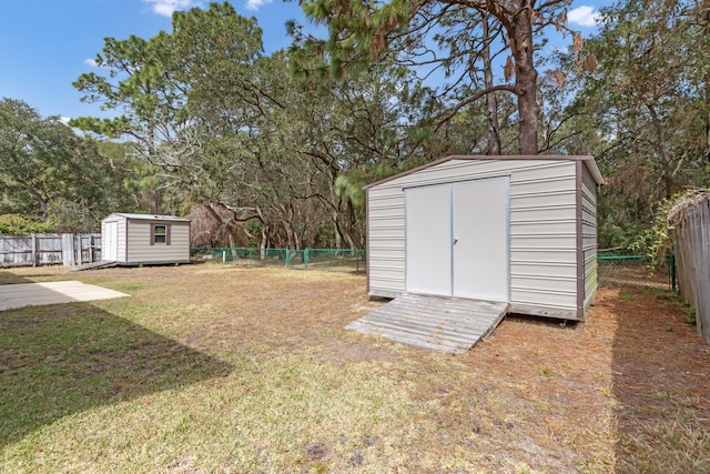 view of shed featuring a fenced backyard