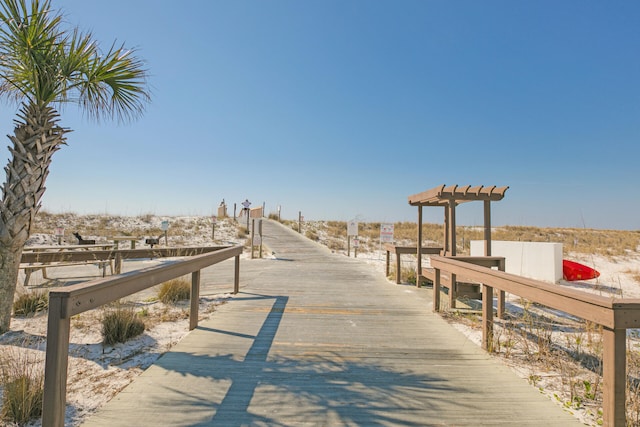 view of community with a boat dock