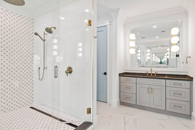 bathroom featuring a stall shower, marble finish floor, crown molding, and vanity