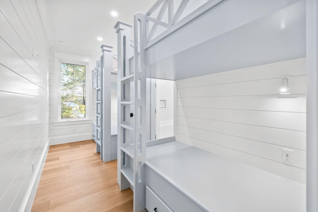 mudroom featuring crown molding, light wood-style flooring, and recessed lighting