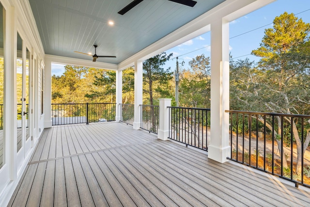 wooden terrace with a ceiling fan