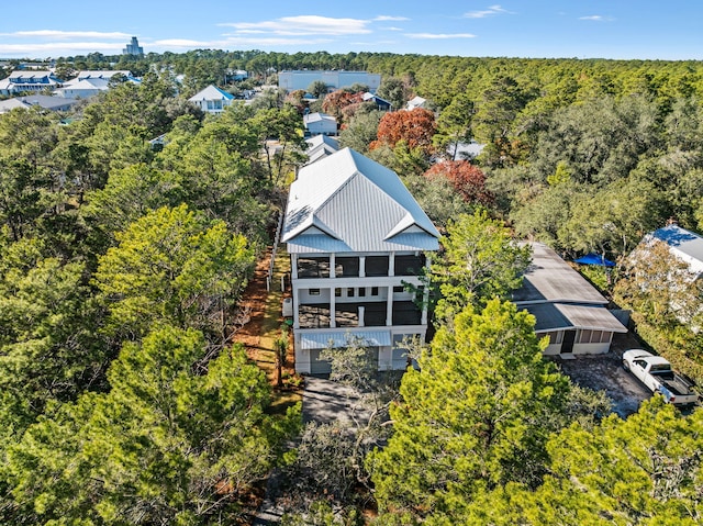 birds eye view of property with a forest view