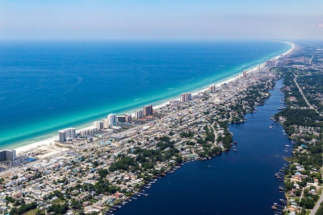 drone / aerial view featuring a water view and a beach view