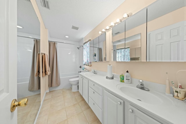 full bathroom with shower / bath combination with curtain, a sink, visible vents, and tile patterned floors