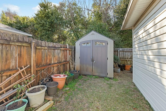 view of shed featuring a fenced backyard