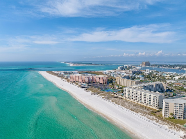 bird's eye view featuring a view of the beach, a water view, and a view of city