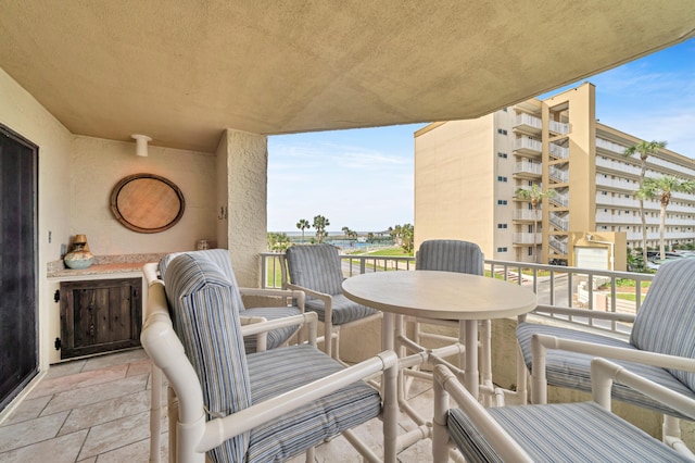 balcony featuring a water view