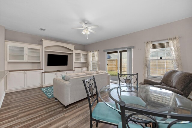 178 E Iron Horse Dr, Crestview, FL 32539 - dining space with visible vents, ceiling fan, and wood finished floors