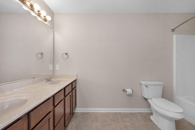 178 E Iron Horse Dr, Crestview, FL 32539 - bathroom featuring baseboards, a sink, toilet, and tile patterned floors