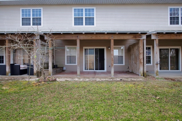 178 E Iron Horse Dr, Crestview, FL 32539 - rear view of house with a patio and a lawn