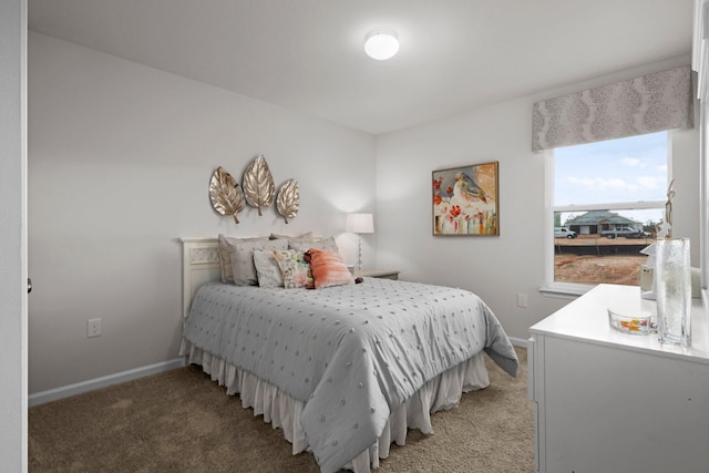 carpeted bedroom with baseboards