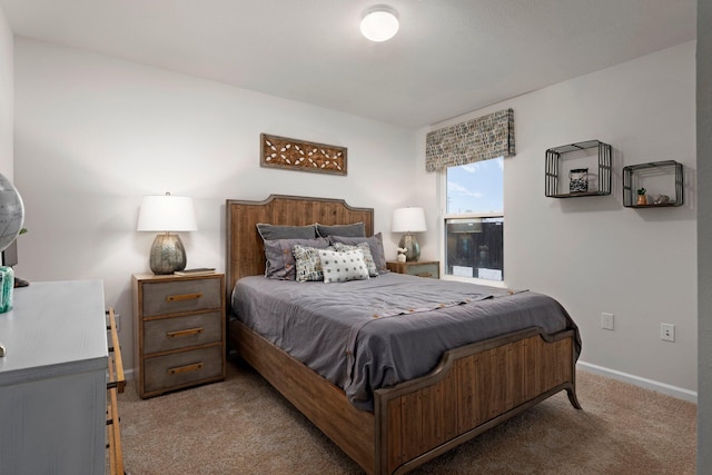 bedroom with carpet floors and baseboards