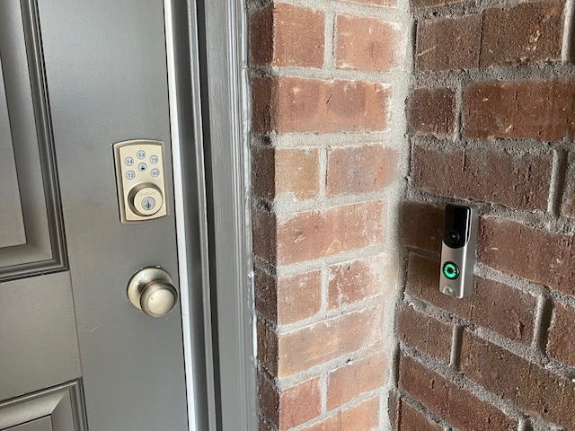 exterior details featuring brick siding