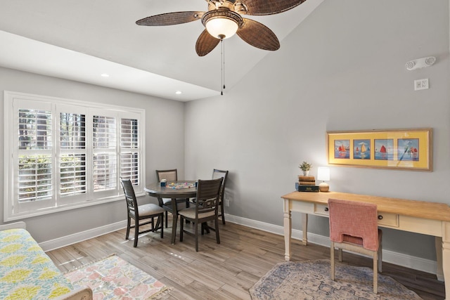 dining area with recessed lighting, baseboards, light wood-type flooring, and lofted ceiling