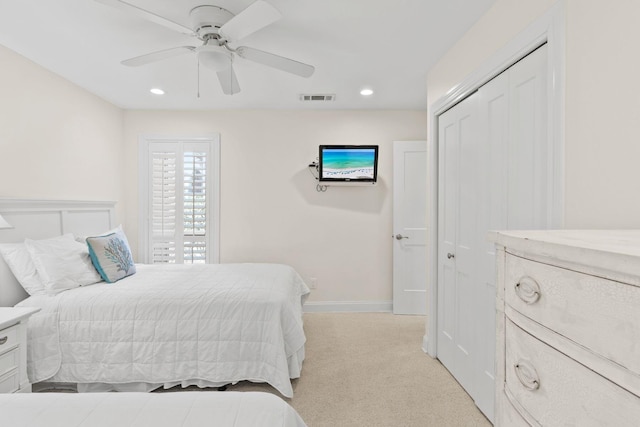 bedroom featuring baseboards, visible vents, recessed lighting, a closet, and light carpet