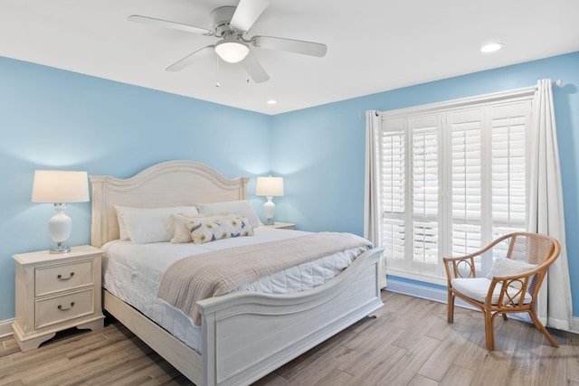 bedroom featuring a ceiling fan, recessed lighting, baseboards, and light wood-type flooring