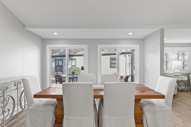 dining room with recessed lighting and wood finished floors