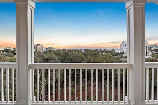 view of balcony at dusk