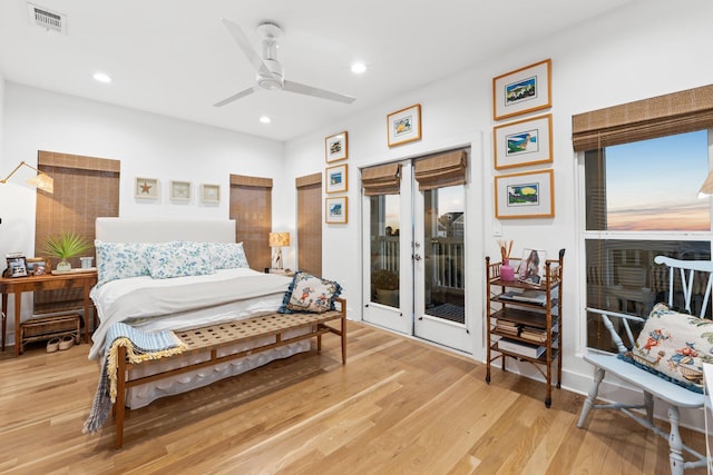 bedroom with light wood-type flooring, access to exterior, visible vents, and recessed lighting