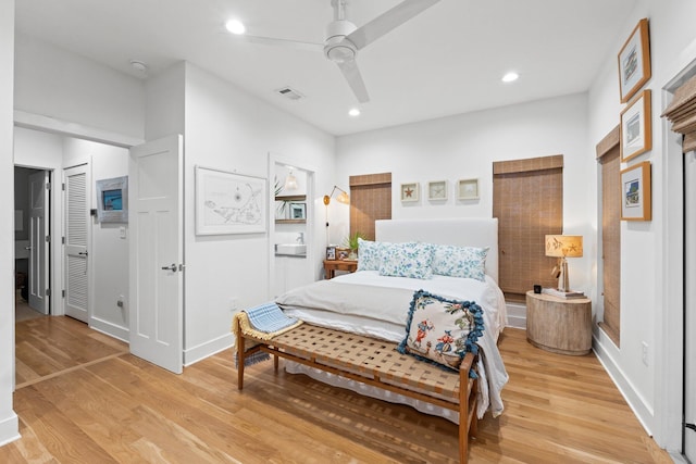 bedroom featuring light wood finished floors, a ceiling fan, visible vents, and recessed lighting