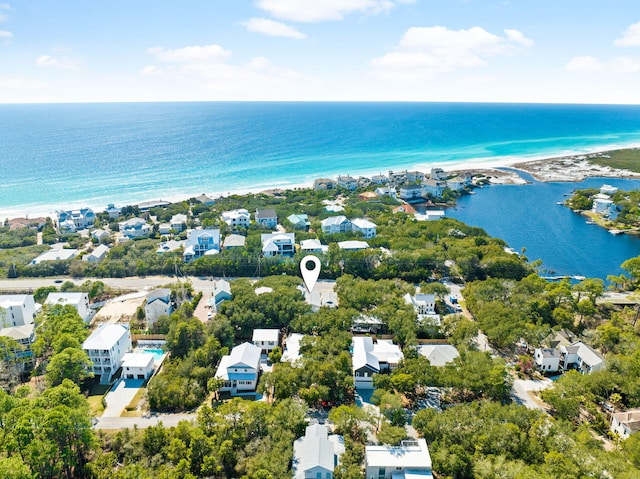 drone / aerial view with a water view and a residential view