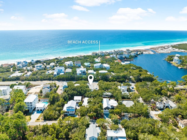 birds eye view of property with a water view and a residential view