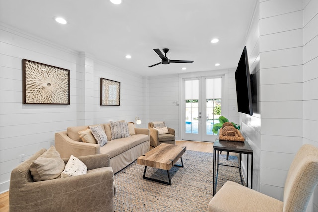 living area featuring ceiling fan, recessed lighting, wood finished floors, french doors, and crown molding