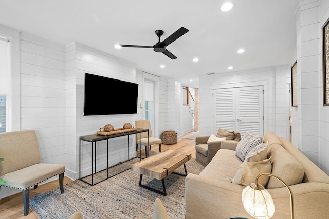 living room with stairway, a ceiling fan, wood finished floors, and recessed lighting