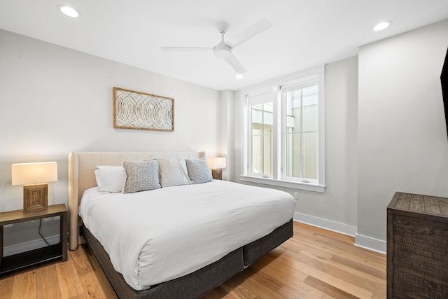 bedroom featuring ceiling fan, recessed lighting, light wood-style flooring, and baseboards