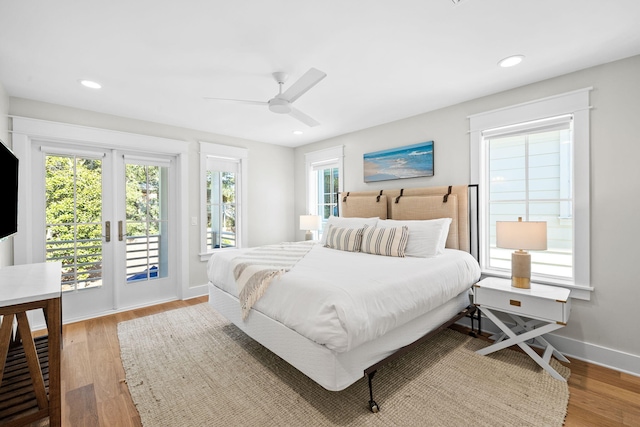 bedroom with recessed lighting, a ceiling fan, wood finished floors, access to outside, and baseboards