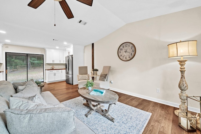 5241 Bob Sikes Rd, Defuniak Springs, FL 32435 - living area featuring vaulted ceiling, ceiling fan, wood finished floors, baseboards, and recessed lighting