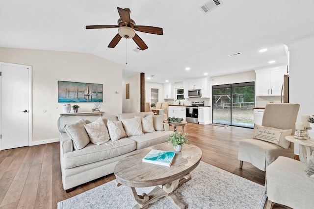 5241 Bob Sikes Rd, Defuniak Springs, FL 32435 - living room with ceiling fan, light wood-type flooring, recessed lighting, vaulted ceiling, and baseboards