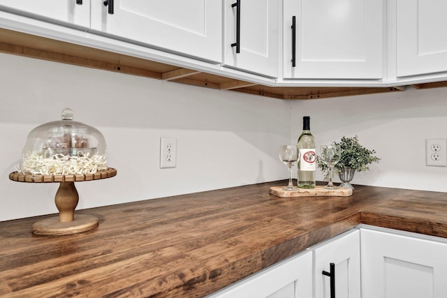 5241 Bob Sikes Rd, Defuniak Springs, FL 32435 - detailed view of white cabinetry and wooden counters