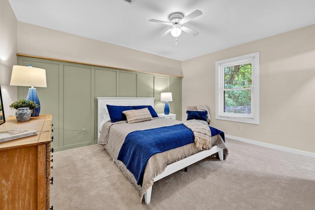 5241 Bob Sikes Rd, Defuniak Springs, FL 32435 - bedroom featuring light colored carpet, a decorative wall, a ceiling fan, and baseboards