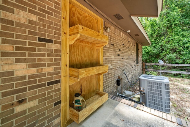 5241 Bob Sikes Rd, Defuniak Springs, FL 32435 - exterior view of cooling unit and brick siding