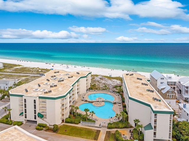 drone / aerial view with a water view and a view of the beach