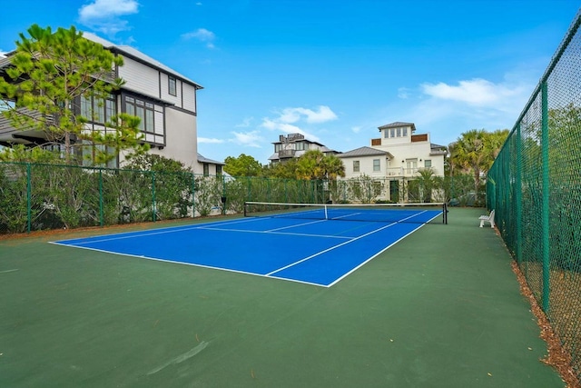 view of tennis court with fence