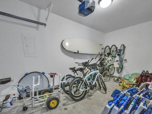 garage featuring electric panel and a garage door opener