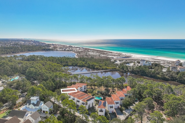 drone / aerial view with a beach view and a water view